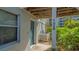 Condo entryway with teal door and AC unit at 1328 Siesta Bayside Dr # 1328-C, Sarasota, FL 34242