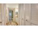 Bathroom with tiled shower, granite countertop, and ample storage at 1328 Siesta Bayside Dr # 1328-C, Sarasota, FL 34242