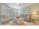 Bright living room with comfy seating and a coastal decor at 1328 Siesta Bayside Dr # 1328-C, Sarasota, FL 34242