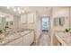 Large bathroom with double vanity and access to bedroom at 1328 Siesta Bayside Dr # 1328-C, Sarasota, FL 34242