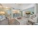 Open living space featuring a breakfast bar and comfy seating at 1328 Siesta Bayside Dr # 1328-C, Sarasota, FL 34242