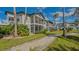 Community view showing building exteriors and landscaping at 1328 Siesta Bayside Dr # 1328-C, Sarasota, FL 34242