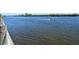 Peaceful waterway view with boat passing by at 1328 Siesta Bayside Dr # 1328-C, Sarasota, FL 34242