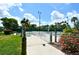 Walkway to tennis courts and pool, lush landscaping at 1328 Siesta Bayside Dr # 1328-C, Sarasota, FL 34242