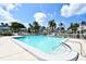 Community pool with surrounding lounge chairs at 1328 Siesta Bayside Dr # 1328-C, Sarasota, FL 34242