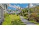A gravel pathway meanders past well-manicured lawns and tropical foliage at 1328 Siesta Bayside Dr # 1328-C, Sarasota, FL 34242