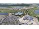 Aerial view of community, including pool, clubhouse, and homes at 15625 San Lazzaro Ave, Bradenton, FL 34211