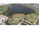 Aerial view of golf course with driving range and lake at 15625 San Lazzaro Ave, Bradenton, FL 34211