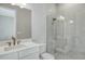 Clean bathroom with white vanity, a large mirror, and a glass shower at 15625 San Lazzaro Ave, Bradenton, FL 34211