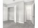 Bedroom with double door closet and grey tile floors at 15625 San Lazzaro Ave, Bradenton, FL 34211