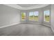 Bright bedroom with wood-look floors and large windows offering scenic views at 15625 San Lazzaro Ave, Bradenton, FL 34211