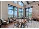 Inviting cafe area with tall ceilings, big windows and modern tables and chairs at 15625 San Lazzaro Ave, Bradenton, FL 34211