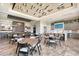 Spacious clubhouse dining area with modern design, sleek furnishings, a full bar, and a large island with bar seating at 15625 San Lazzaro Ave, Bradenton, FL 34211