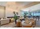Upscale clubhouse lounge area with fireplace, elegant lighting, comfortable seating, and large windows with outdoor views at 15625 San Lazzaro Ave, Bradenton, FL 34211