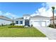 Single-story home with gray roof, white walls, and blue shutters at 15625 San Lazzaro Ave, Bradenton, FL 34211
