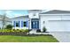 Two-story home with gray roof, white walls, and blue shutters at 15625 San Lazzaro Ave, Bradenton, FL 34211