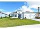 Single-story home with gray roof, white walls, and blue shutters at 15625 San Lazzaro Ave, Bradenton, FL 34211