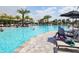 Relaxing resort-style pool with lounge chairs and umbrellas at 15625 San Lazzaro Ave, Bradenton, FL 34211