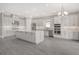 Modern kitchen with stainless steel appliances and white cabinetry at 15625 San Lazzaro Ave, Bradenton, FL 34211