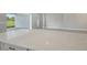 Large kitchen island with white quartz countertop at 15625 San Lazzaro Ave, Bradenton, FL 34211