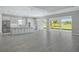 Spacious kitchen with island, stainless steel appliances, and white cabinets at 15625 San Lazzaro Ave, Bradenton, FL 34211