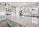 Gourmet kitchen with expansive island and quartz countertops at 15625 San Lazzaro Ave, Bradenton, FL 34211