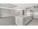 Open concept kitchen with island and adjoining dining area at 15625 San Lazzaro Ave, Bradenton, FL 34211