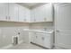 Laundry room with white cabinets and sink at 15625 San Lazzaro Ave, Bradenton, FL 34211