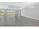 Spacious living room with large sliding doors opening to the outdoors at 15625 San Lazzaro Ave, Bradenton, FL 34211