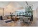 Expansive lounge area with designer lighting, comfortable seating, and lush greenery at 15625 San Lazzaro Ave, Bradenton, FL 34211
