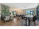Open lounge and dining area with decorative lights, large windows, and modern finishes at 15625 San Lazzaro Ave, Bradenton, FL 34211