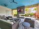 Relaxing outdoor lounge with fireplace and TV at 15625 San Lazzaro Ave, Bradenton, FL 34211