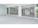 Covered patio with sliding glass doors opening to living area and kitchen at 15625 San Lazzaro Ave, Bradenton, FL 34211