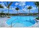 Resort-style pool with lounge chairs and palm trees at 15625 San Lazzaro Ave, Bradenton, FL 34211