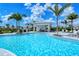 Community pool with lounge chairs and covered seating area at 15625 San Lazzaro Ave, Bradenton, FL 34211