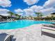 Resort-style pool with lounge chairs and umbrellas at 15625 San Lazzaro Ave, Bradenton, FL 34211