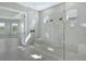 Spa-like shower with glass enclosure and pebble floor at 15625 San Lazzaro Ave, Bradenton, FL 34211