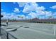 Tennis court with modern lighting and fencing at 15625 San Lazzaro Ave, Bradenton, FL 34211