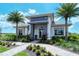 Community clubhouse with a modern design and landscaping at 15625 San Lazzaro Ave, Bradenton, FL 34211