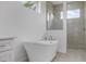 Elegant bathroom featuring a freestanding tub and walk-in shower at 16381 Cape Horn Blvd, Punta Gorda, FL 33955