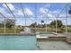Screened pool and spa with a tranquil lake view at 16381 Cape Horn Blvd, Punta Gorda, FL 33955