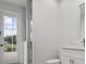Bathroom with glass-enclosed shower and exterior access at 16381 Cape Horn Blvd, Punta Gorda, FL 33955