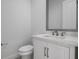 Modern powder room with white vanity and marble countertop at 16381 Cape Horn Blvd, Punta Gorda, FL 33955