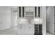 Built-in wet bar with wine cooler and glass-front cabinets at 16381 Cape Horn Blvd, Punta Gorda, FL 33955