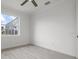 Spacious bedroom with large window and ceiling fan at 16381 Cape Horn Blvd, Punta Gorda, FL 33955