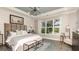 Main bedroom with large window, plush bedding, and wood flooring at 16443 Star Grass Cir, Bradenton, FL 34211
