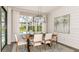 Elegant dining area with a view of the backyard and pool at 16443 Star Grass Cir, Bradenton, FL 34211