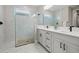 Bathroom with a large shower, double vanity, and modern finishes at 16742 Savory Mist Cir, Bradenton, FL 34211