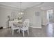 Bright dining room with table and chairs, and hardwood floors at 17626 Gawthrop Dr # 201, Bradenton, FL 34211