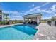 Community pool with a covered seating area at 17626 Gawthrop Dr # 201, Bradenton, FL 34211